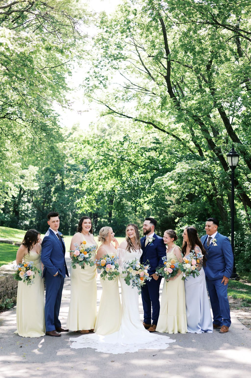 bridal party looking at each other and laughing
