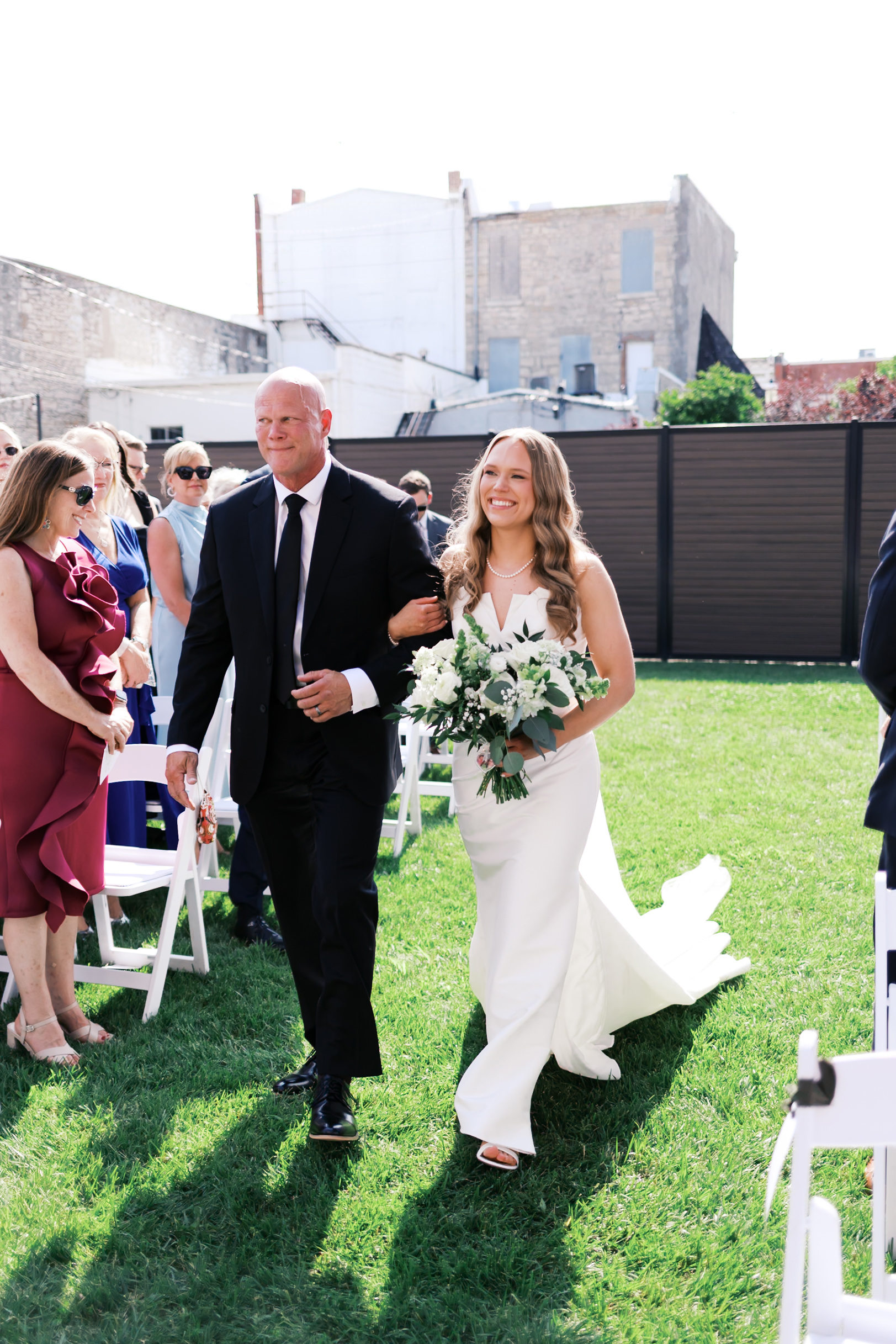 Bride being walked down the aisle
