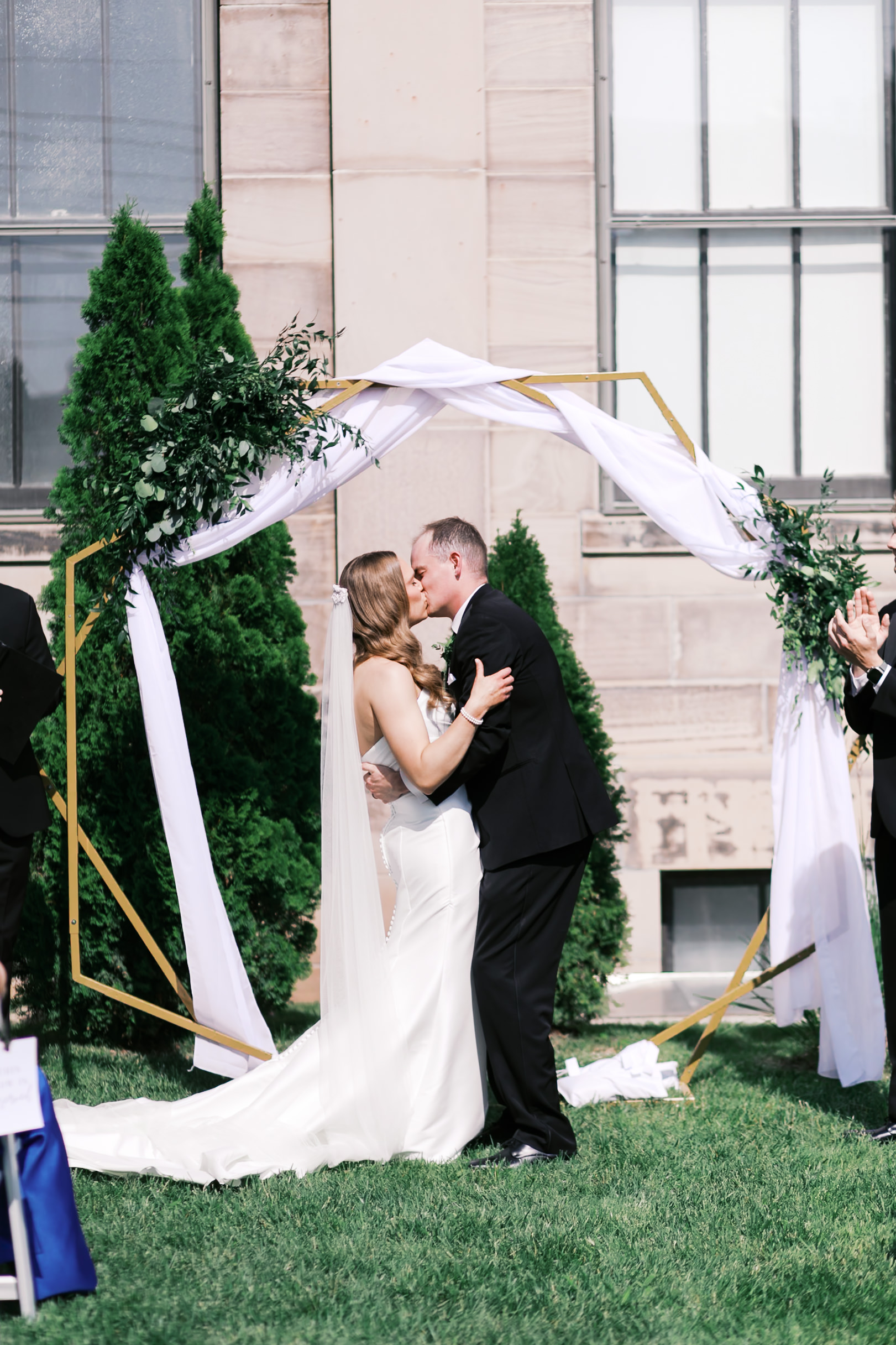 bride and groom kissing at ceremony