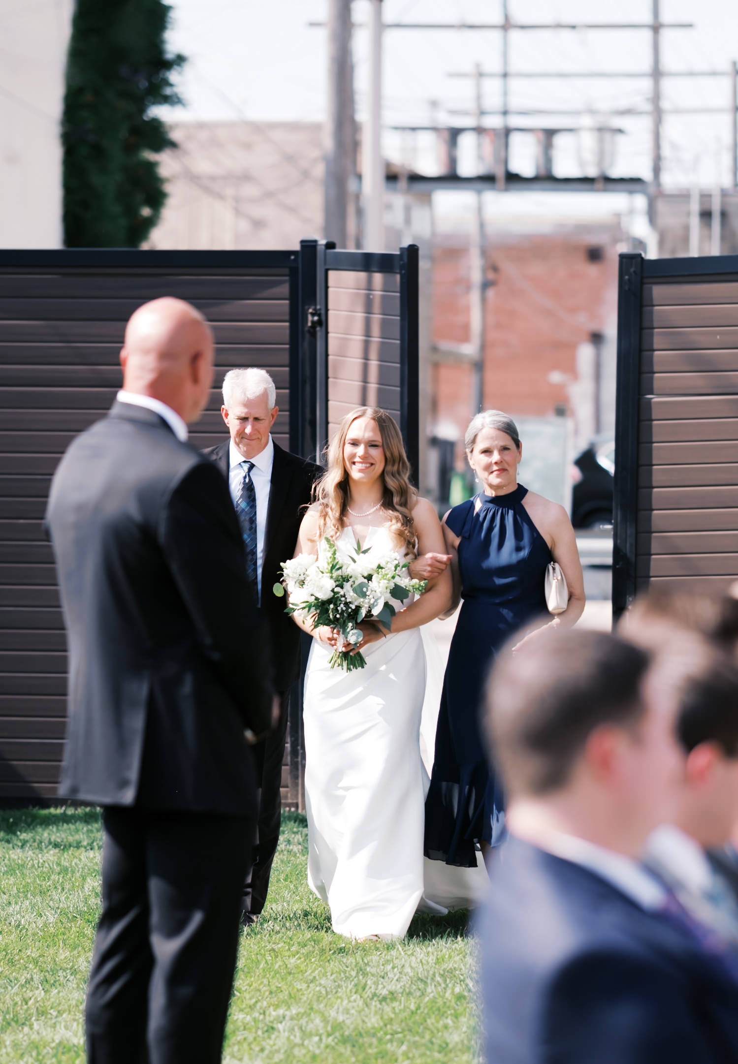 bride walking down the aisle at outdoor wedding