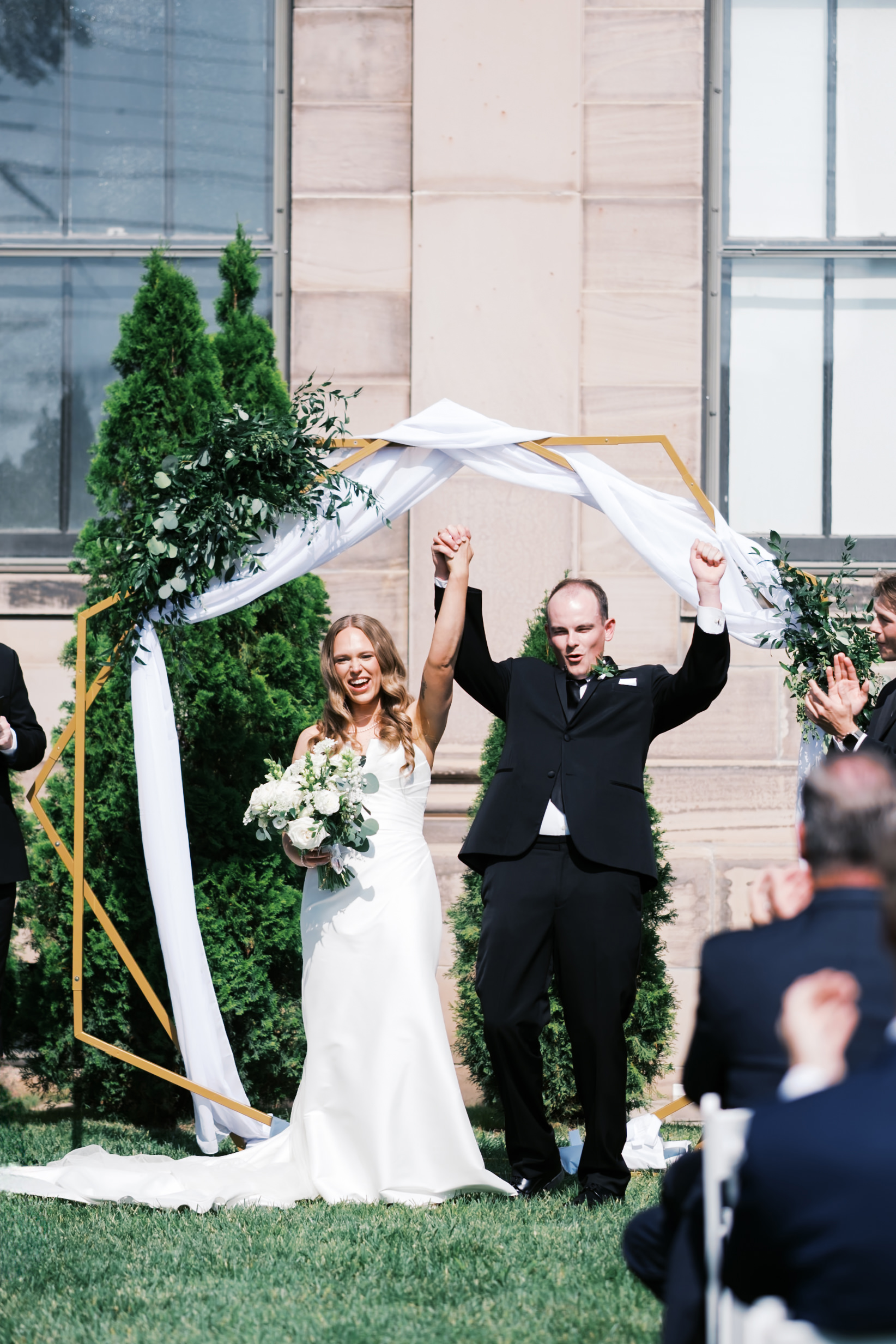 Bride and groom celebrating at the end of the ceremony