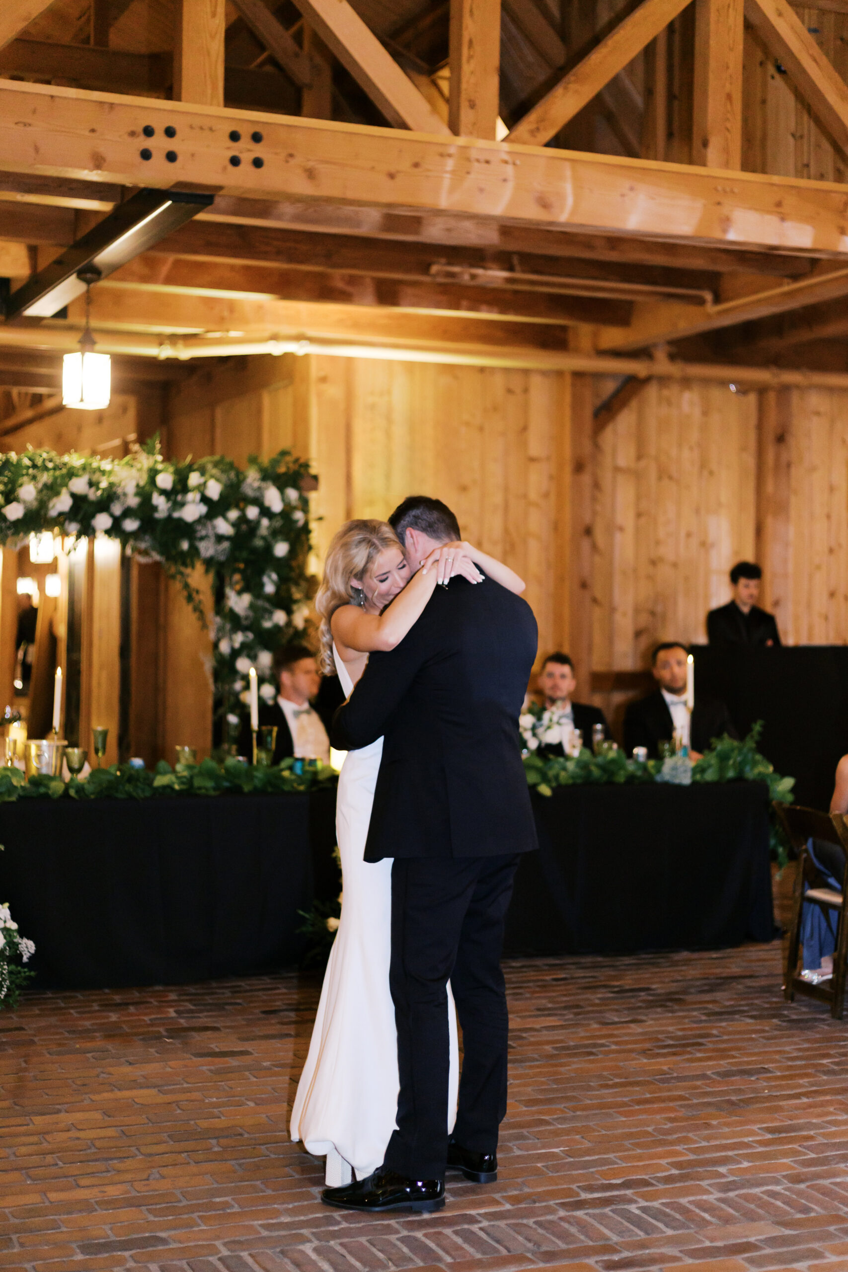 Couple embracing on the dance floor during their first dance.