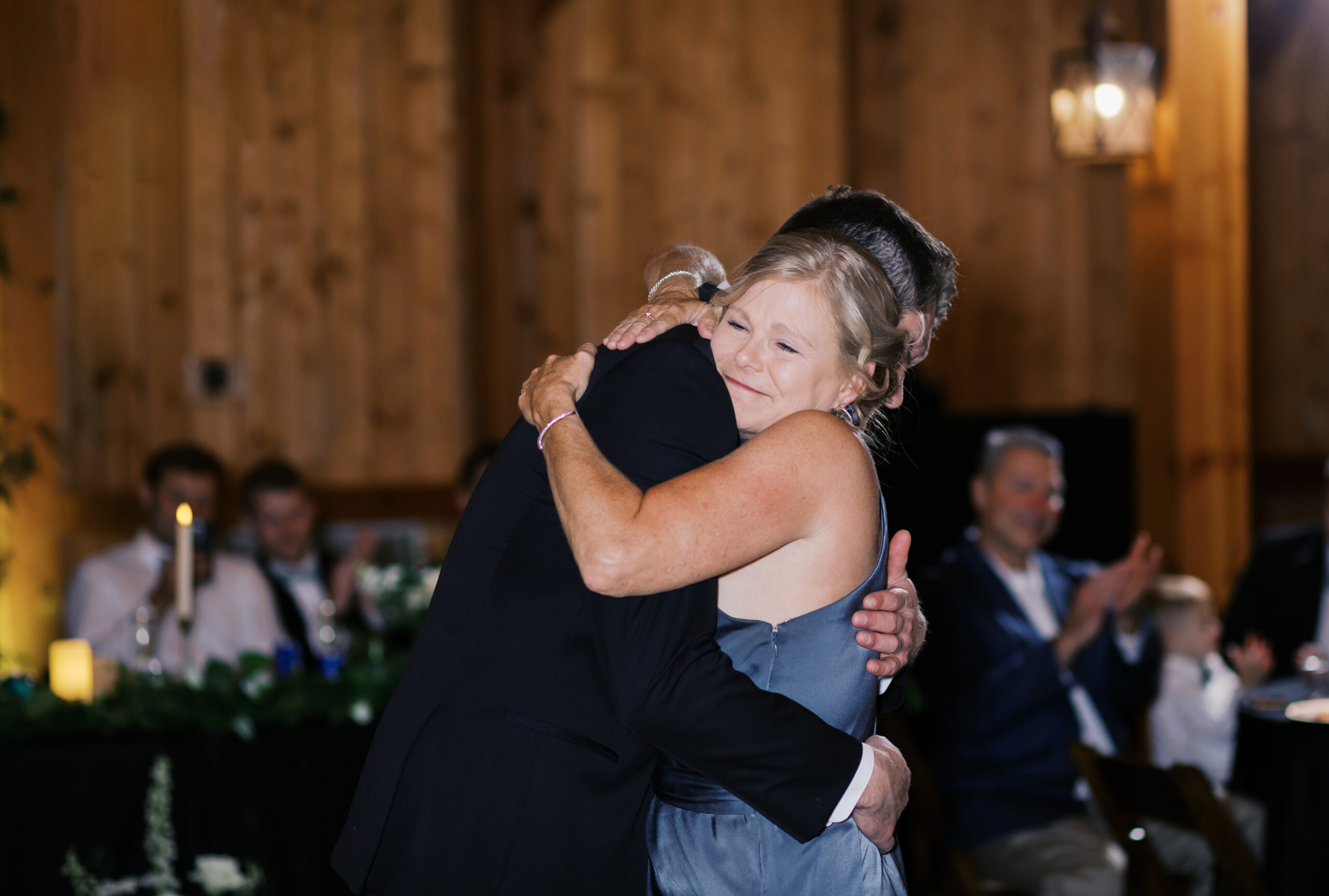 Mother of the groom hugging her son during their dance