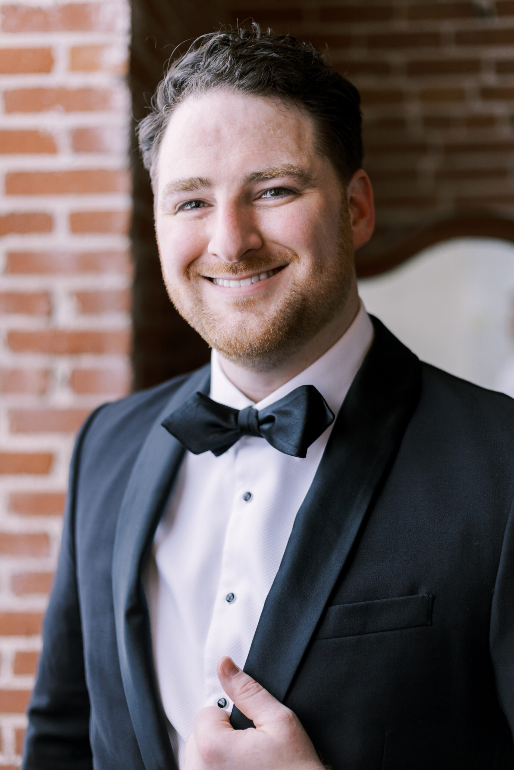 groom getting ready at the oliver building in the westbottoms of kansas city