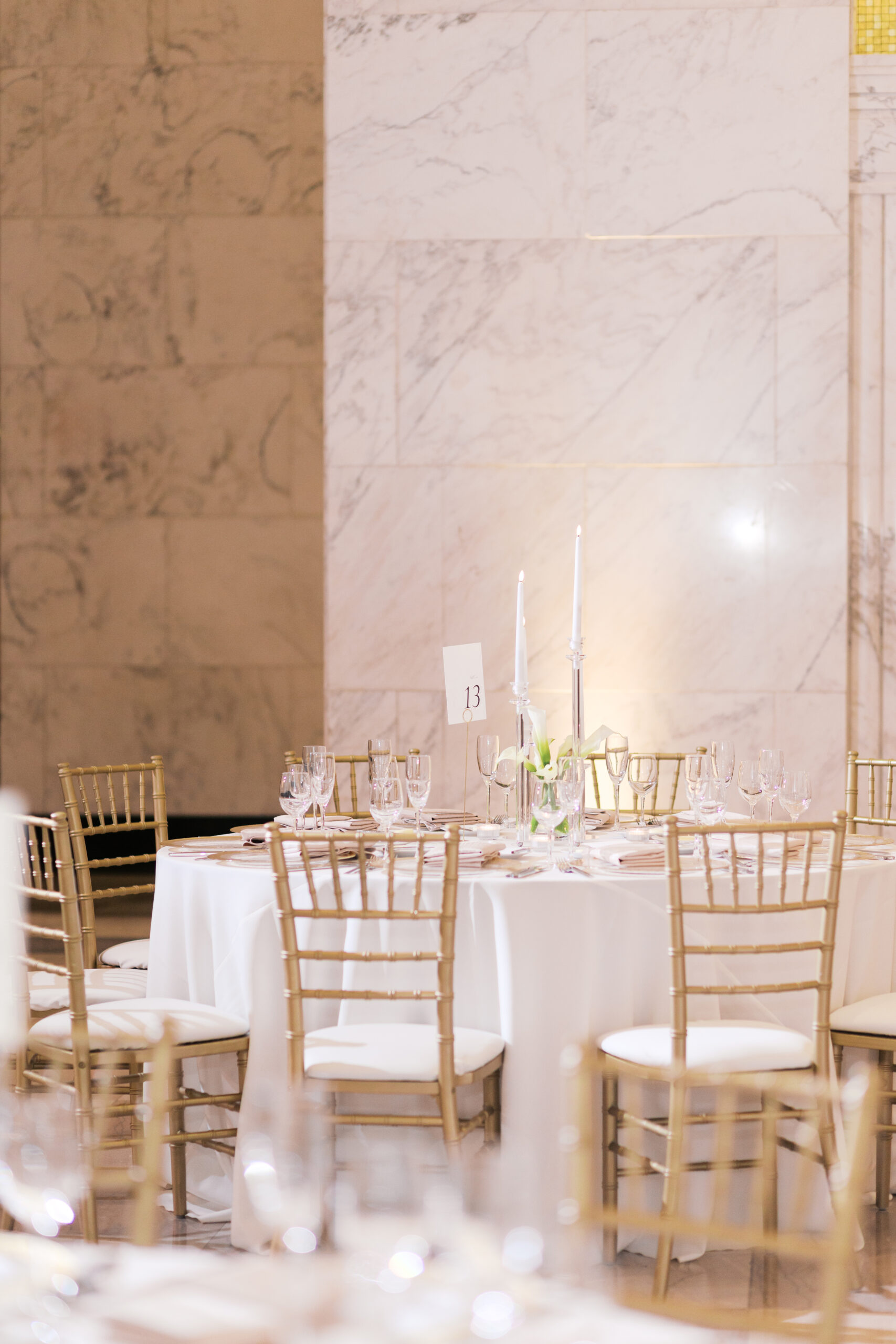Reception table at the Old Post Office Chicago decorated in white and gold