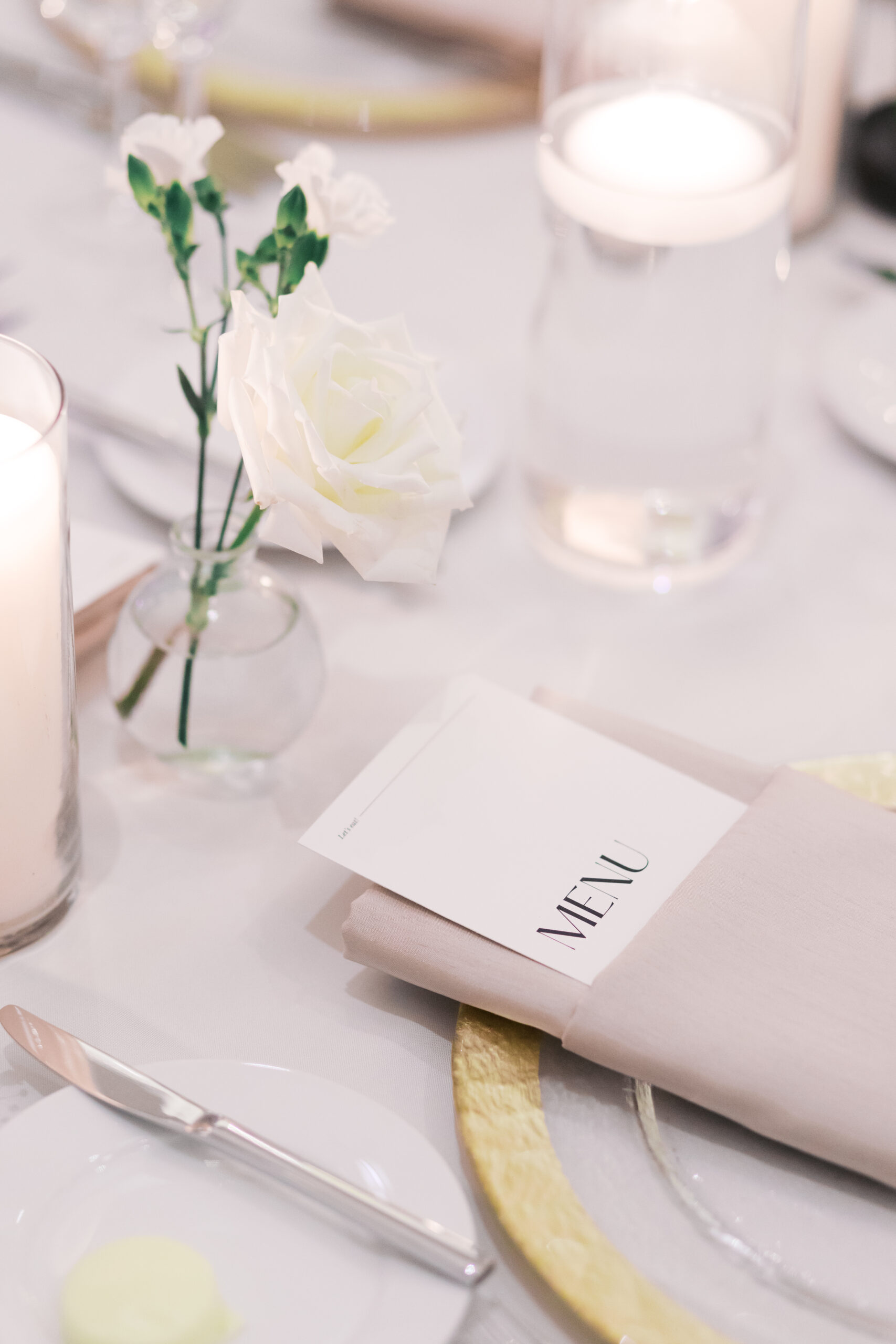 Close up of the menu card folded into the napkin on a reception table.