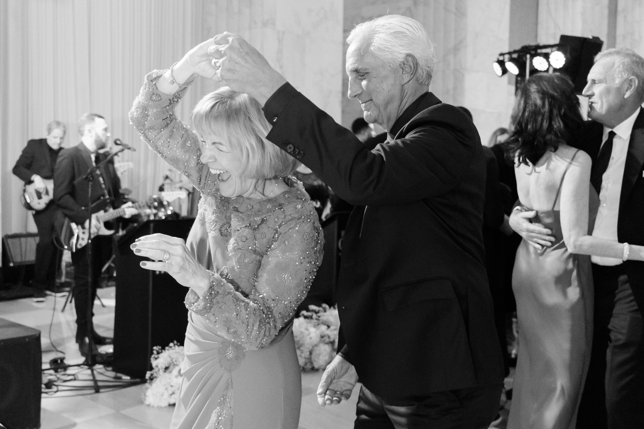 Black and white photo of two guests dancing