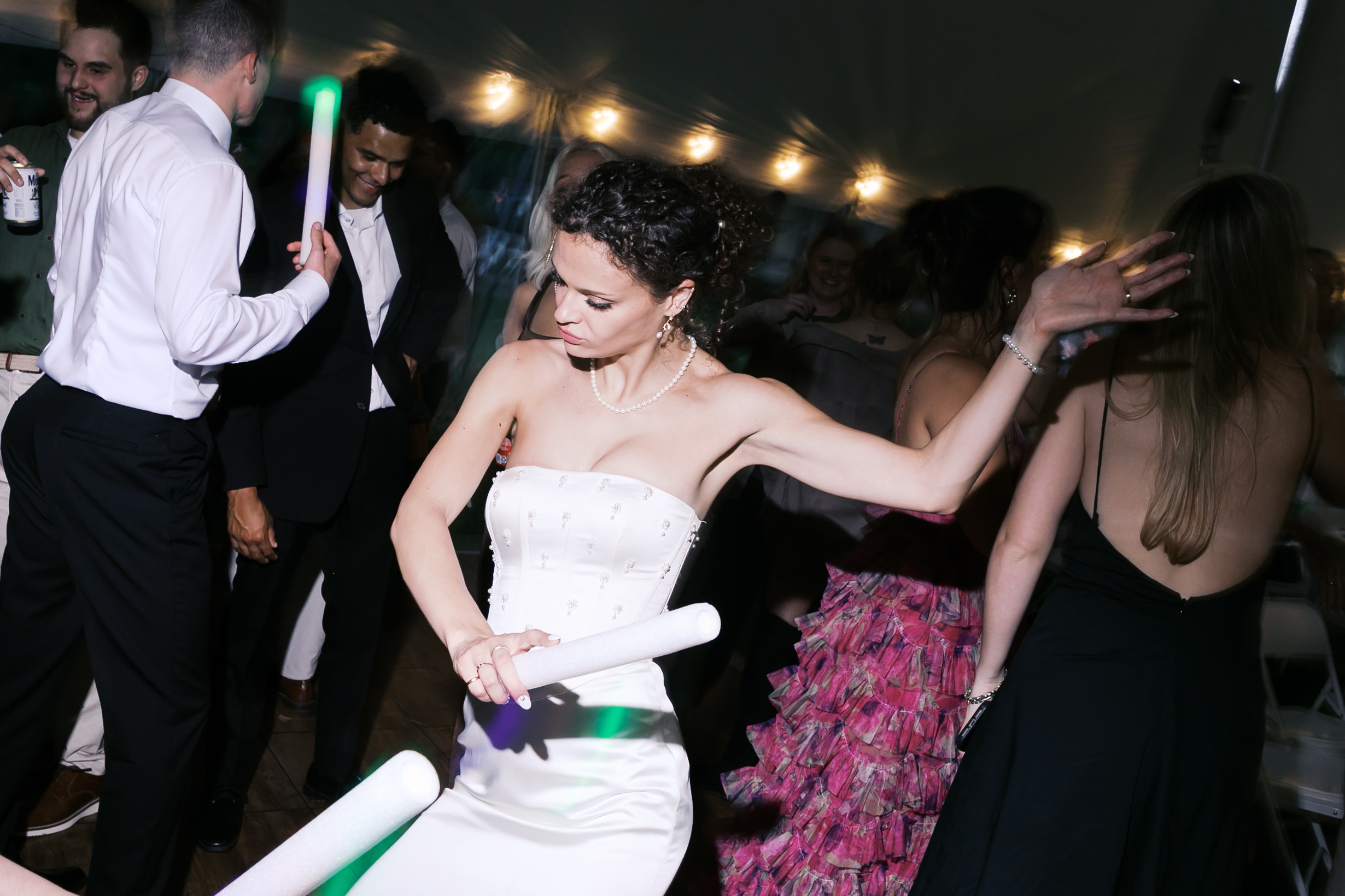 Bride dancing on a reception dance floor.