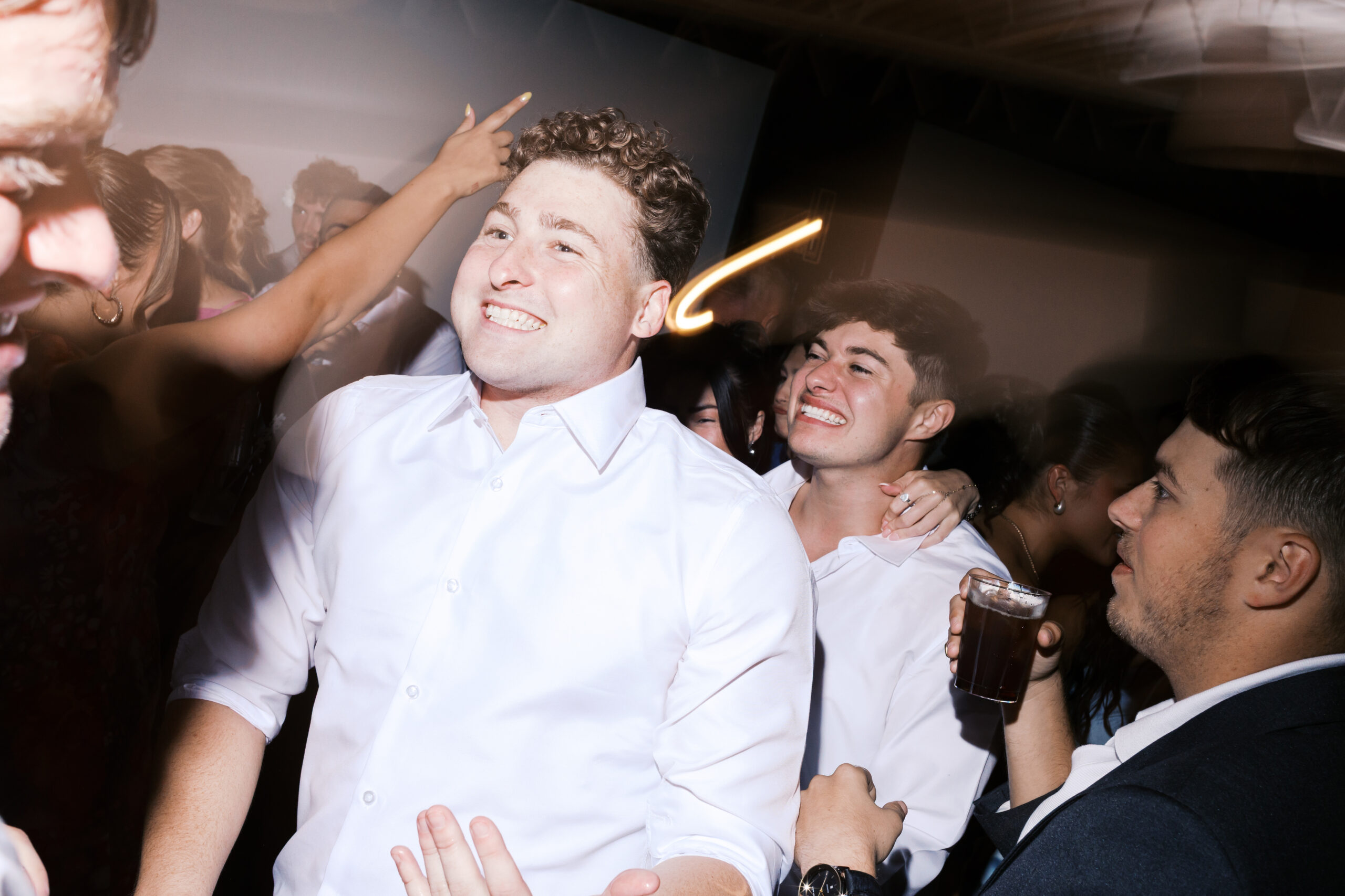 Two men smiling and dancing