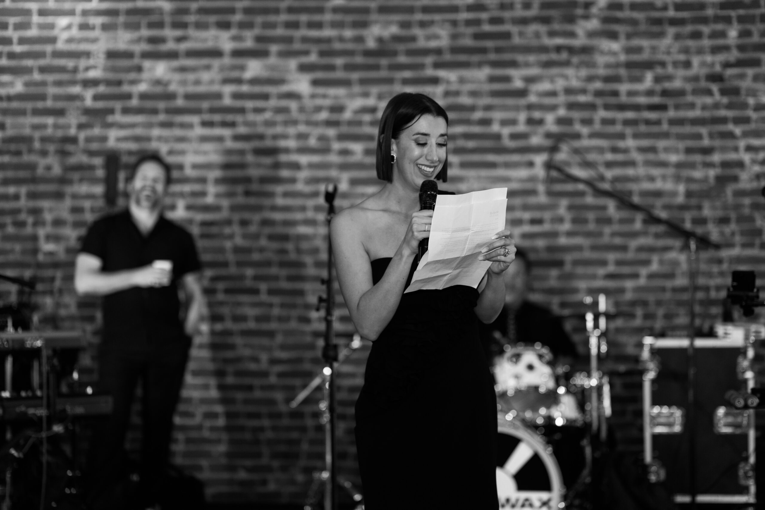 Bride and groom sharing a bite of dessert together during the reception.