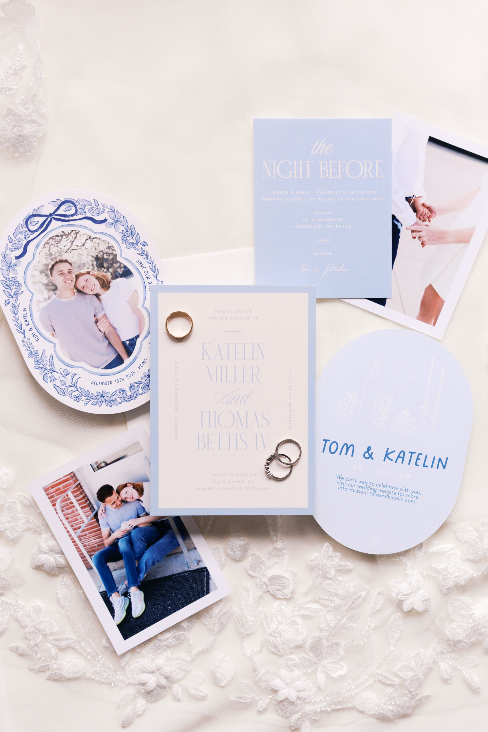 Blue and white wedding invitation suite with photos, rings, and lace fabric background