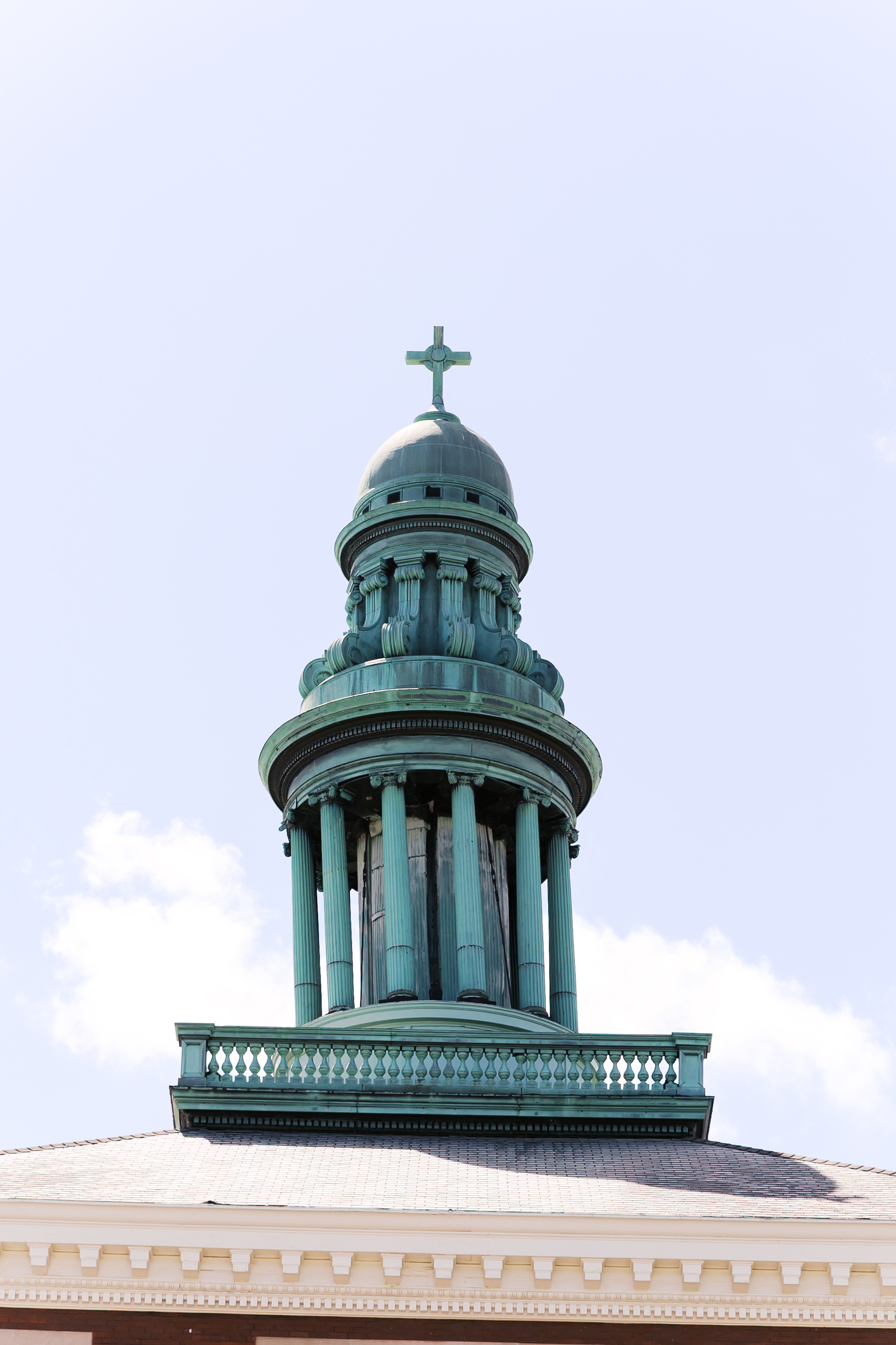 Close-up of The Loretto's signature copper dome and cross, highlighting the venue's historic architecture.