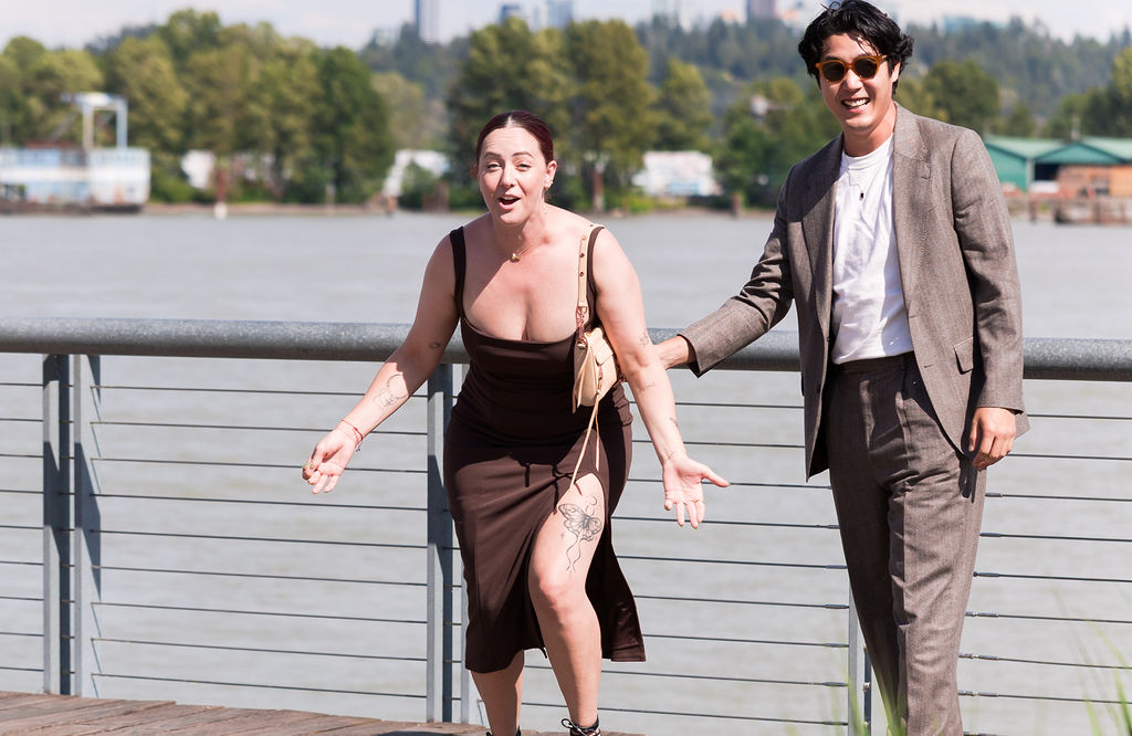 The couple smiles in surprise moments after getting engaged.